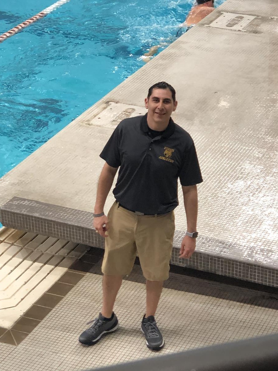 Coach Gallardo at the 2019 UIL Swimming & Diving Championship 
Austin, TX - University of Texas. 